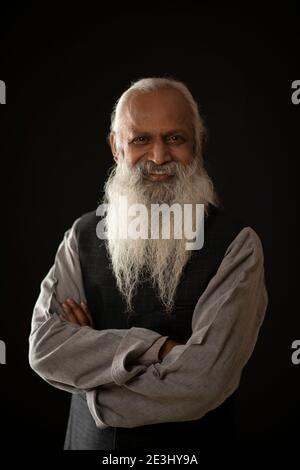 PORTRAIT OF A HAPPY OLD MAN LOOKING AT CAMERA Stock Photo