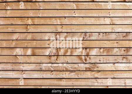 New modern brown wooden fence panel background with rough knotted grain timber texture, stock photo image Stock Photo