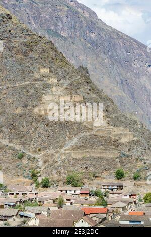 View of Pinkuylluna mountain and qullqas from Ollantaytambo, an Inca archaeological site in the Sacred Valley in Urubamba, Cusco Region, southern Peru Stock Photo