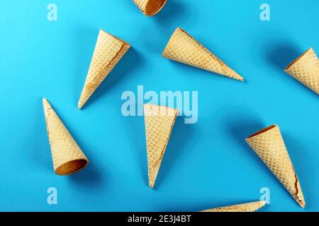 Emty Ice cream cones pattern on colored background. Top view. Several wafer ice cream cones designe Stock Photo