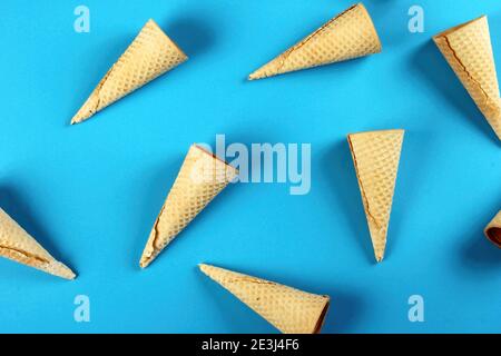 Emty Ice cream cones pattern on colored background. Top view. Several wafer ice cream cones designe Stock Photo