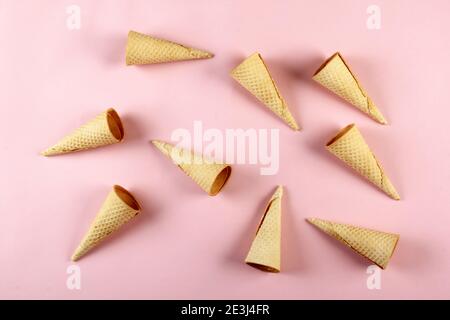 Emty Ice cream cones pattern on colored background. Top view. Several wafer ice cream cones designe Stock Photo