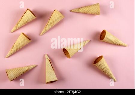 Emty Ice cream cones pattern on colored background. Top view. Several wafer ice cream cones designe Stock Photo