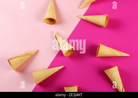 Emty Ice cream cones pattern on colored background. Top view. Several wafer ice cream cones designe Stock Photo