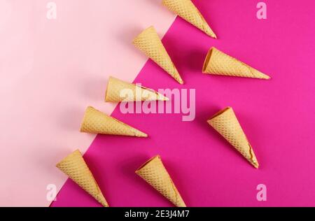 Emty Ice cream cones pattern on colored background. Top view. Several wafer ice cream cones designe Stock Photo