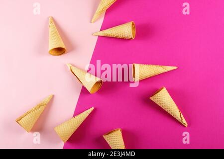Emty Ice cream cones pattern on colored background. Top view. Several wafer ice cream cones designe Stock Photo