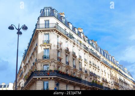 Architecture in Paris . Typical residential house in french style . Balcony with flowers Stock Photo