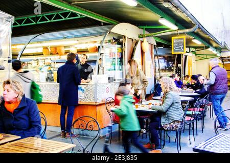 PARIS, FRANCE - JANUARY 28, 2017: People eat at Marche des Enfants Rouges ('Red Children Market '). This oldest covered market in Paris. Stock Photo