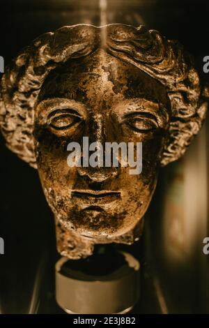 The gilt bronze head of the goddess Sulis Minerva inside Roman Baths Spa in the city of Bath, England, UK. Stock Photo