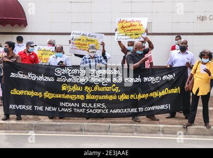 Colombo, Sri Lanka. 19th Jan, 2021. Members of Sri Lanka's Frontline Socialist Party (FSP) hold a banner during a protest in front of the Indian High Commission in Colombo, Sri Lanka, 19 January 2021. FSP supporters staged a protest in Colombo to express their solidarity and support to the ongoing farmers' protest in India, against the new agriculture laws. (Photo by Saman Abesiriwardana/Pacific Press) Credit: Pacific Press Media Production Corp./Alamy Live News Stock Photo