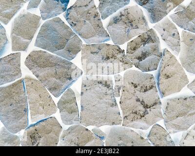 Rock Wall Reversed - A rock wall at Camaya Coast, digitally manipulated to make it a negative. Stock Photo