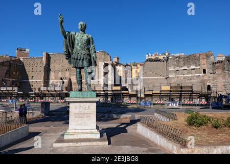Roman Emperor Nerva (Marcus Cocceius Nerva) bronze statue at Via dei Fori Imperiali in Rome, Italy, Forum of Augustus in the background. Stock Photo