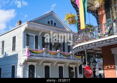 NEW ORLEANS, LA, USA - JANUARY 14, 2021: Houses decorated for Mardi Gras at the corner of Royal and Dumaine Streets in the French Quarter Stock Photo