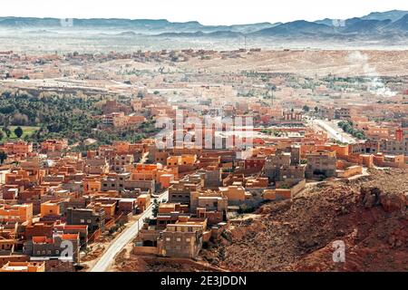 Panorama of berber city of Tinghir in Sahara desert against red canyon and mountains in the background, Morocco Stock Photo