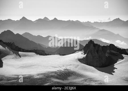 Sea of mountains and snow, cliff waves. Majestic view from Agui du Midi of Mont Blanc massif in summer. Chamonix, Alps, France. Black white photo. Stock Photo