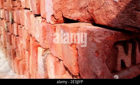 Texture of old dark brown and red brick wall background Stock Photo