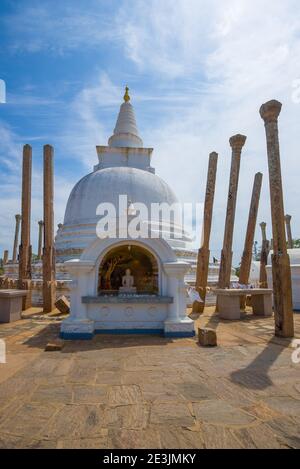 At the ancient stupa of Thuparamaya on a sunny day. Anuradhapura, Sri Lanka Stock Photo