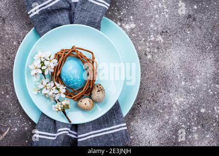Easter table setting with blue egg Stock Photo