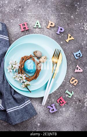 Easter table setting with blue egg Stock Photo