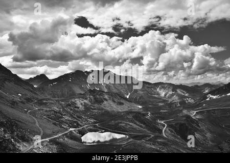 Majestic mountain landscape with lake from Les Arcs 2000 ski station in Red Peaks massif in summer. Savoie, France.Black and white photo. Stock Photo