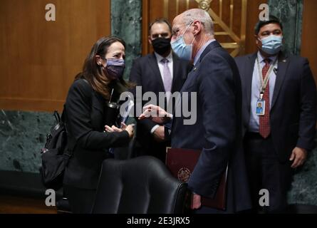 Washington, United States. 19th Jan, 2021. Avril Haines and Dan Coats, former Director of National Intelligence, speak to each other during the Senate Intelligence Committee confirmation hearing to consider her to be President-elect Joe Biden's pick for national intelligence director on January 19, 2021 in Washington, DC. Haines was previously Deputy Director of the CIA and Deputy National Security Advisor in the Obama administration. Pool Photo by Joe Raedle/UPI Credit: UPI/Alamy Live News Stock Photo