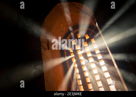 Sun rays going through arch window inside temple filled with smoke, UNESCO, Bagan, Mandalay Region, Myanmar Stock Photo