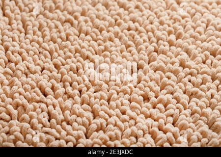 The structure of beige wool fibers in full screen as a background. View from above Stock Photo