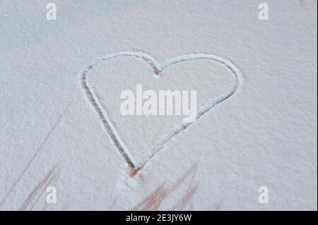 heart in the snow. background for Valentine's Day.lovers background Stock Photo