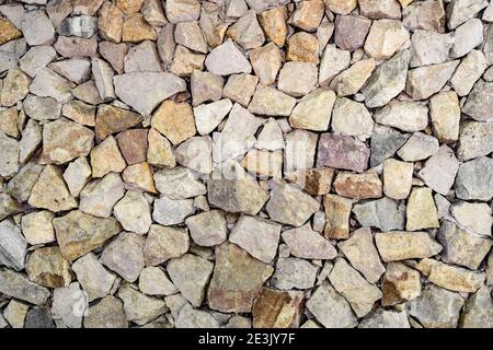 Multicolored textured stone wall.  Background. Stock Photo