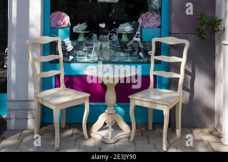 A place to have enjoy and relax. Two chairs and a table on the street. City life. Stock Photo