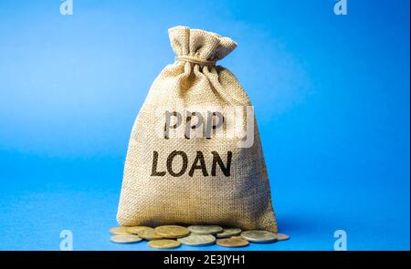 Money bag with the word PPP loan - Paycheck Protection Program. Loan designed to provide a direct incentive for small businesses to keep their workers Stock Photo
