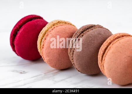Colorful Fruity Macarons Flat Lay and Top View on White Marble Table Stock Photo