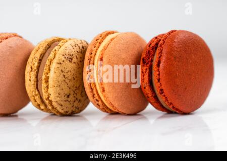 Colorful Fruity Macarons Flat Lay and Top View on White Marble Table Stock Photo