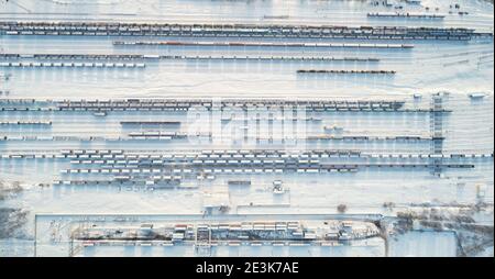Railway cargo station aerial above top drone view snow covered