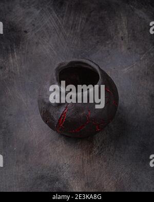 Handmade ceramic cup on dark stone backgroud, copy space. Stock Photo