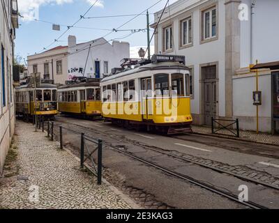 Classic Yellow Tram in Alfama,  the oldest neighborhood of Lisbon, Portugal, Europe. Stock Photo