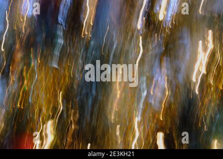 Abstract - Wiggly lines of light combine with streaks of luminous blue and gold. Stock Photo
