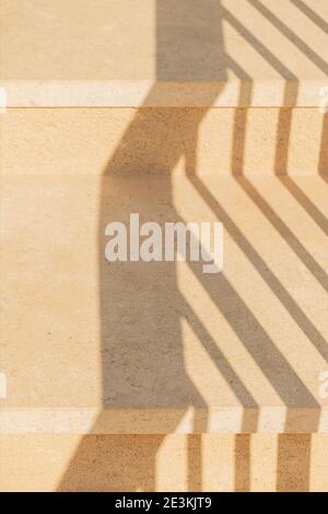 Geometric shadows on stone yellow steps background Stock Photo