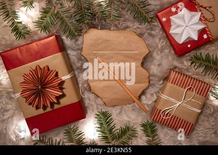 Handmade Decorative Gift Boxes and Wishlist under the Christmas tree Stock Photo
