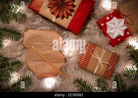 Handmade Decorative Gift Boxes and Wishlist under the Christmas tree Stock Photo