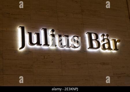 Lugano, Ticino, Switzerland - 14th January 2021 : Luminous Julius Baer Bank sign hanging on a building facade in Lugano. Julius Baer is a Swiss multin Stock Photo
