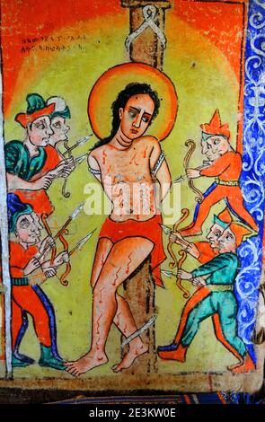 A painting in the Azewa Mariam Monastery, near Bahir Dar, Ethiopia, depicts the crucifixion of Christ -- nonbelievers are always shown in side-profile Stock Photo