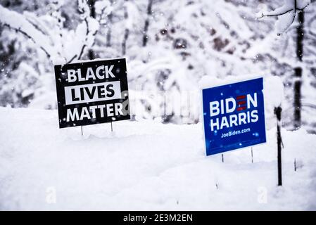 Dramatic image of Black Lives Matter, Biden Harris signs in the snow. Stock Photo