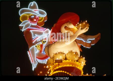 Iconic neon cowgirl sign and sign  for the Golden Goose casino at Glitter Gulch on Fremont Street in Las Vegas, Nevada