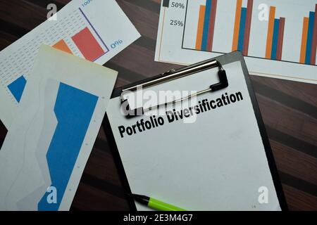 Portfolio Diversification write on a paperwork isolated on Wooden Table. Stock Photo
