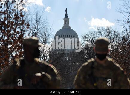 Washington, United States. 19th Jan, 2021. National Guard soldiers guard the U.S Capitol Building the day before the inauguration ceremonies for President-elect Joe Biden. As many as 25,000 armed National Guard troops are expected in DC due to threats of violent protests. Credit: SOPA Images Limited/Alamy Live News Stock Photo