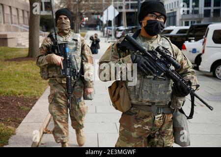 Washington, United States. 19th Jan, 2021. Armed military personnel patrol the street.After the January 6th riots at the US Capitol, the FBI has issued a statement warning of further threats to the nation's capital as well as in all fifty states. In the waning hours of the current administration some 25,000 National Guardsmen have been deployed to the city to stand guard in preparation for Joe Biden's inauguration as the 46th U.S. President. Credit: SOPA Images Limited/Alamy Live News Stock Photo