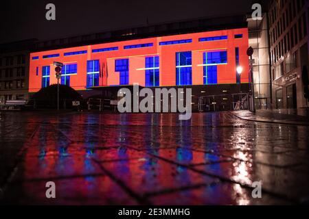Berlin, Germany. 19th Jan, 2021. The façade of the French Embassy on Pariser Platz is illuminated. This is a test run for a multimedia show that is intended to celebrate the friendship between the two countries on Franco-German Day on 22 January. Credit: Paul Zinken/dpa-Zentralbild/dpa/Alamy Live News Stock Photo