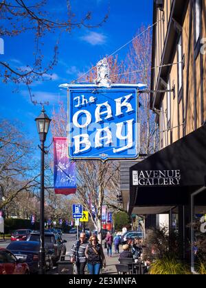 A view of the Oak Bay Theatre neon sign, in the historic Castle Block on Oak Bay Avenue in Oak Bay Village, Victoria, Canada. Stock Photo