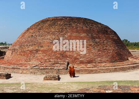 9th March 2020, Kolhua , Vaishali, Bihar, India.  Ananda Stupa with an Asokan pillar.  Relic Stupa which encases one of the eight portions of the Budd Stock Photo